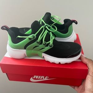Green and black Nike Prestos